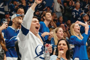 a person cheering in a stadium