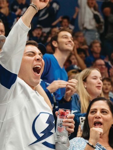 a person cheering in a stadium