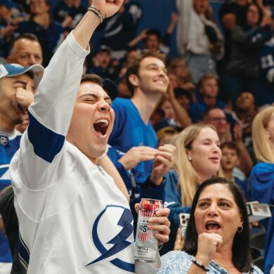 a person cheering in a stadium