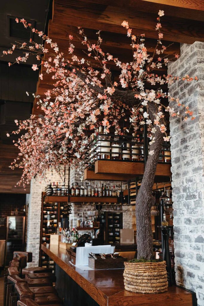 a tree with flowers in a restaurant